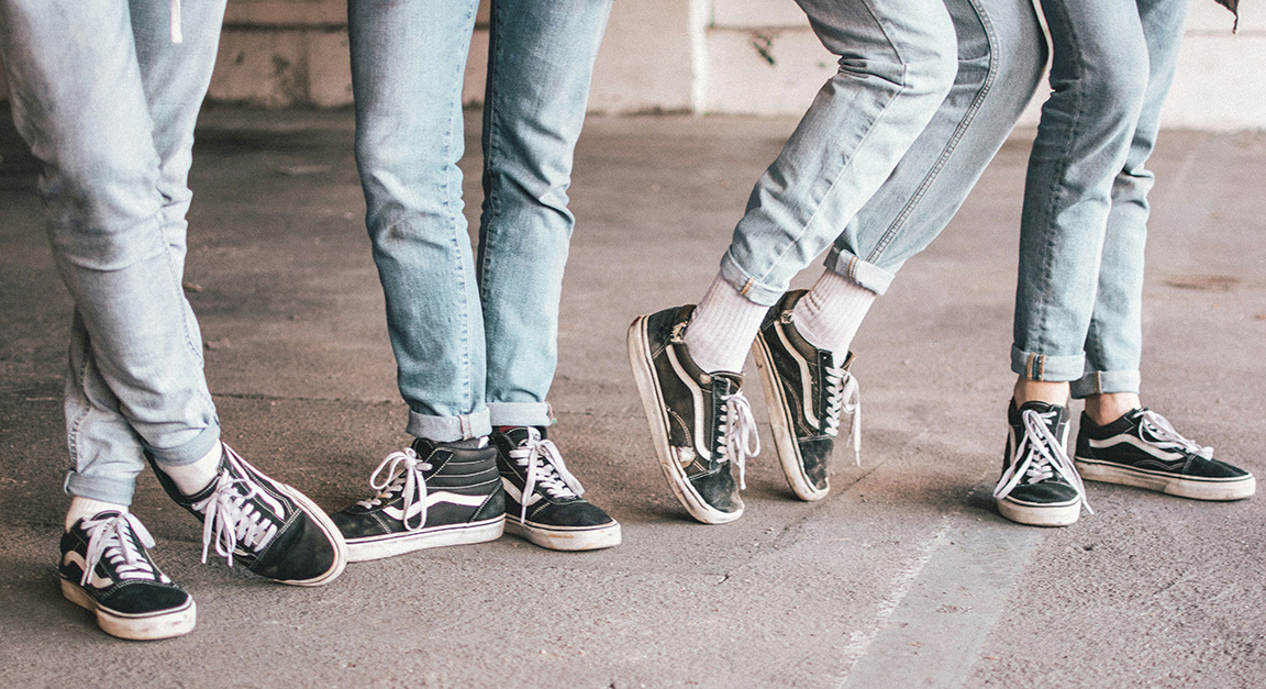Youth wearing jeans and tennis shoes